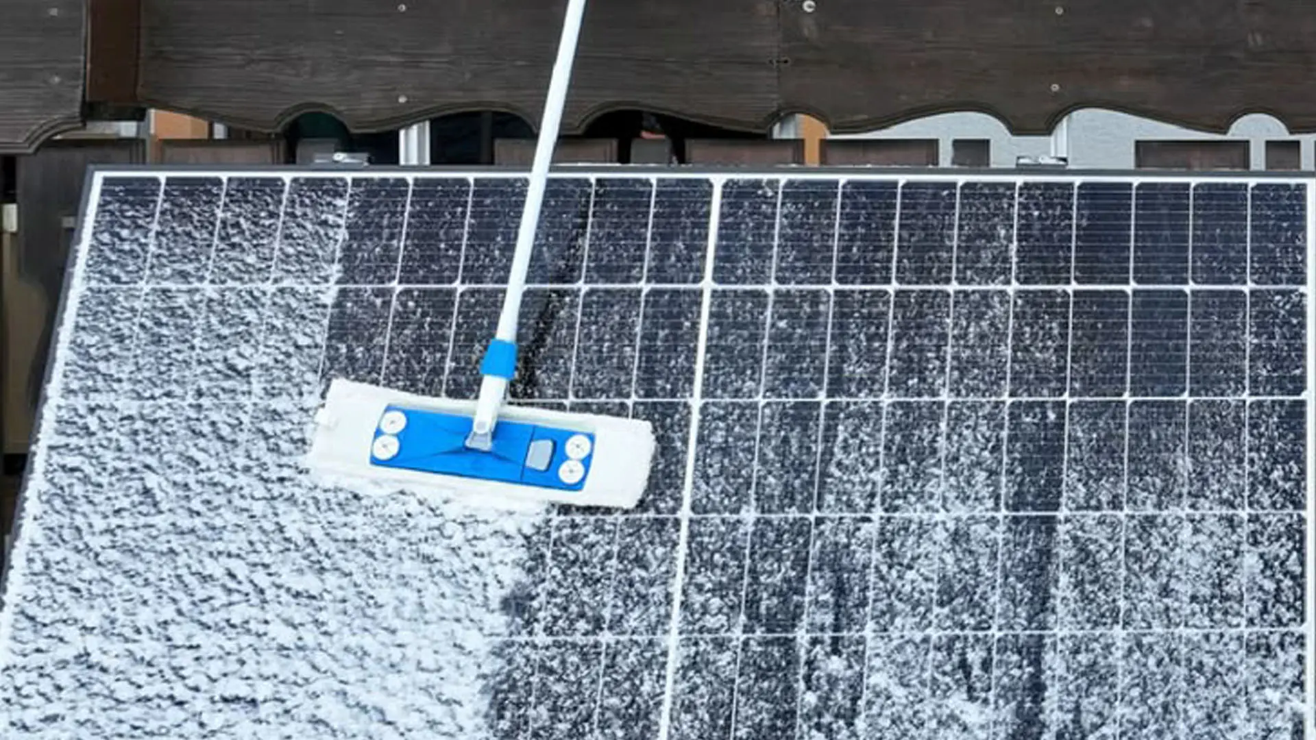 90a6d4c6-f1e7-4324-8442-8cc6c6e72ae8-cleaning-snow-from-solar-panels.webp